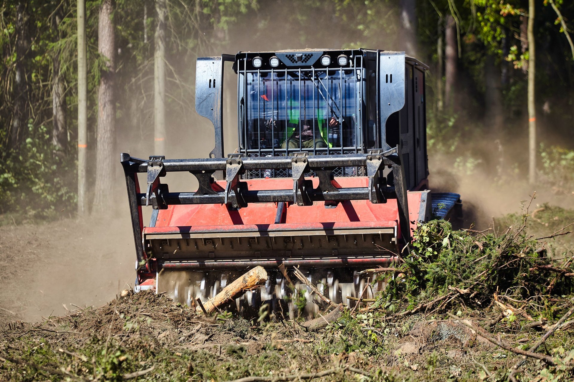 Forestry mulcher clearing overgrown land