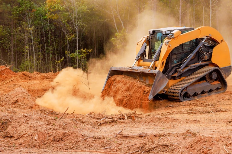 Heavy machinery clearing land for future development